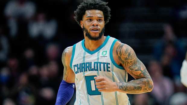 FILE - Charlotte Hornets forward Miles Bridges (0) moves up court during an NBA basketball game against the Denver Nuggets on Monday, March 28, 2022, in Charlotte, N.C. Hornets forward Miles Bridges was arrested Wednesday, June 29, 2022, in Los Angeles after a warrant was issued, according to the Los Angeles Police Department. The details of the arrest and the charges were not immediately available. (AP Photo/Rusty Jones, File)